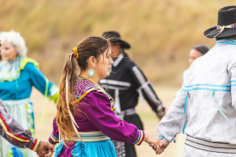 Woman dancing in a circle at Red Earth